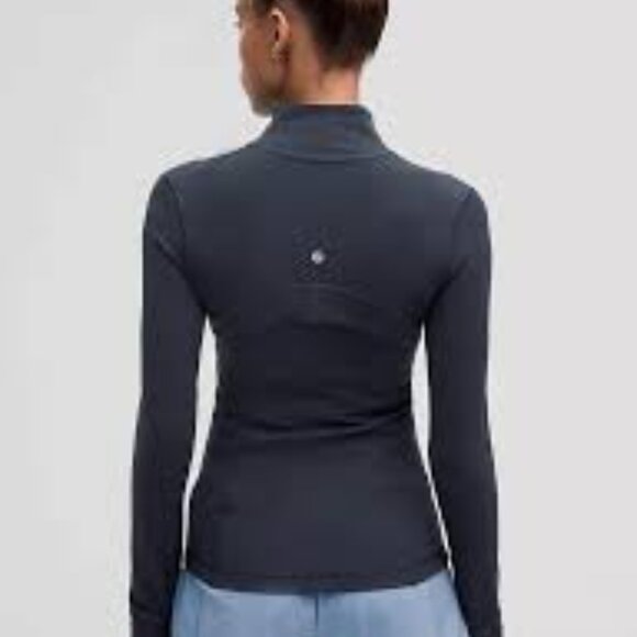 Lululemon Athletica navy
Luon Define
Size 12
Zipup jacket
Thumb holes 
Pockets - Picture 6 of 14
